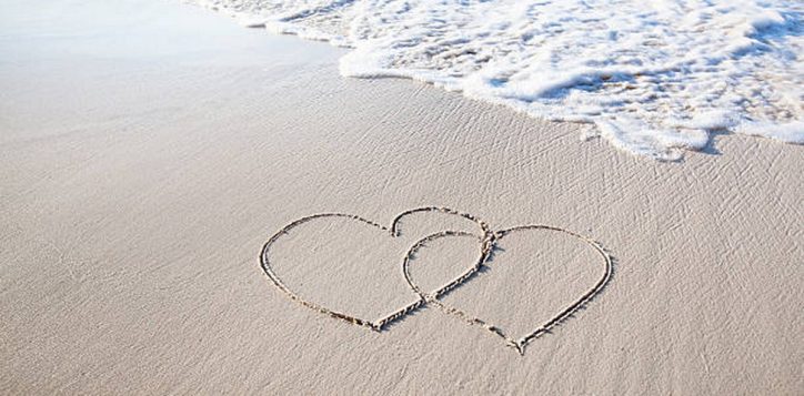 two-hearts-drawn-on-perfectly-white-sand-of-paradise-beach-2